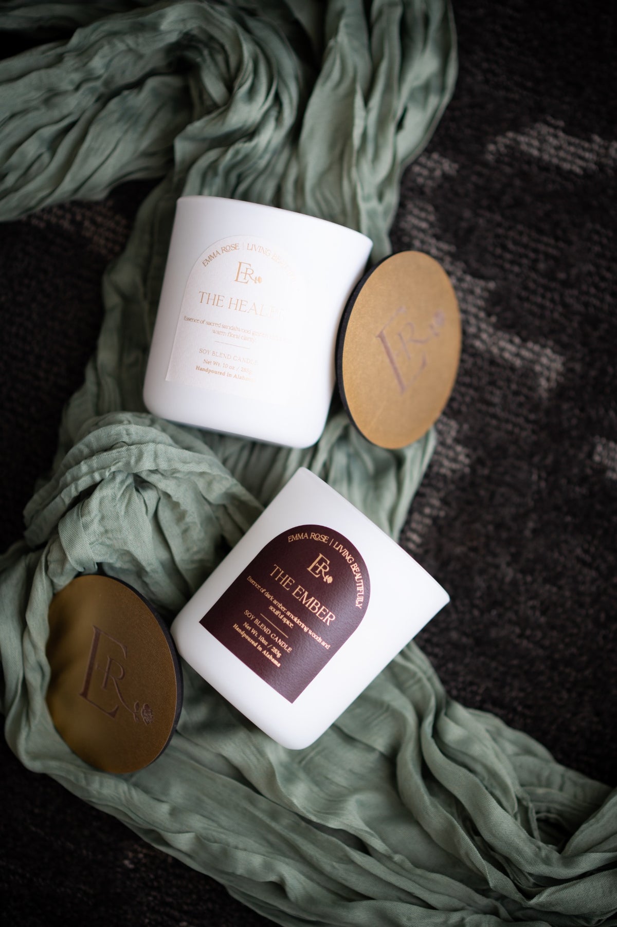 The Healer candle styled with sage fabric and engraved lid
